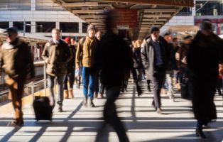 unrecognizable-person-tourist-visiting-south-station-walking-out-from-train-into-station-boston-massachusetts-usa 1